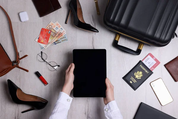 Woman Preparing Essentials Business Trip Wooden Floor Top View — Foto de Stock