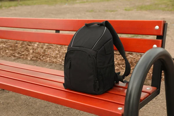 Stylish Black Backpack Camera Wooden Bench Outdoors — 스톡 사진
