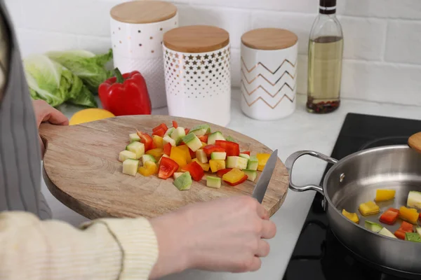 Woman Putting Cut Vegetables Saute Pan Kitchen Closeup — 스톡 사진