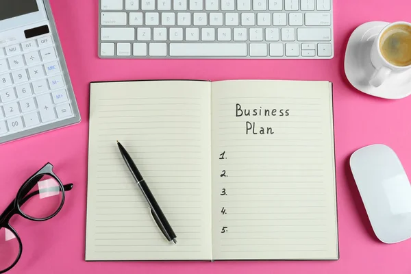 Flat Lay Composition Notebook Words Business Plan Pink Background — Zdjęcie stockowe