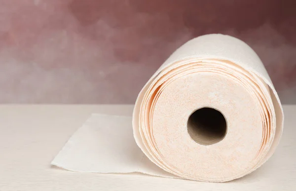 Roll Paper Towels White Wooden Table Pink Wall Closeup Space — стоковое фото