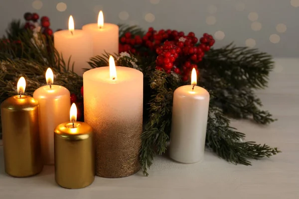 Different Burning Candles Christmas Decor White Wooden Table — Fotografia de Stock