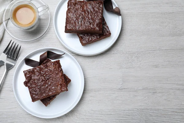 Delicious Chocolate Brownies Served White Wooden Table Flat Lay Space — стоковое фото