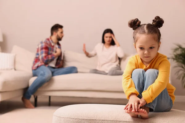 Sad Little Girl Her Arguing Parents Sofa Living Room — стоковое фото