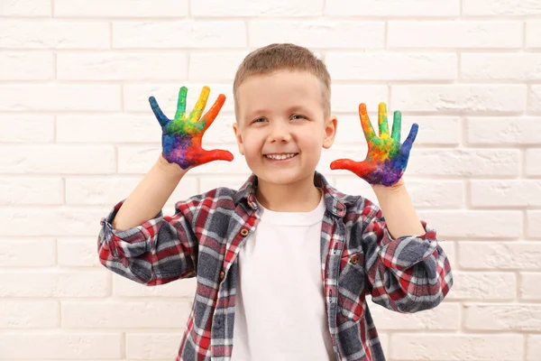 Happy Little Boy Showing Painted Palms White Brick Wall — Fotografia de Stock