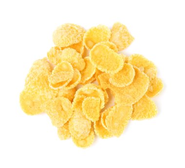 Beyaz arka planda lezzetli mısır gevreği yığını, üst manzara. Sağlıklı kahvaltı gevreği