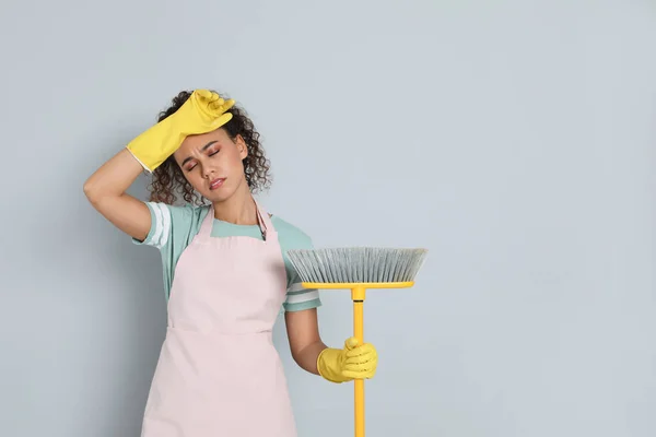 Tired African American Woman Yellow Broom Grey Background Space Text — Zdjęcie stockowe