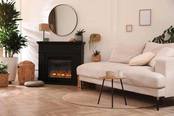 Stylish Living Room Interior Electric Fireplace Comfortable Sofa Beautiful Decor — стоковое фото