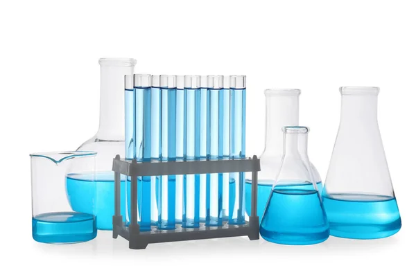 Різні Лабораторні Скляні Посуд Світло Блакитною Рідиною Білому Тлі — стокове фото