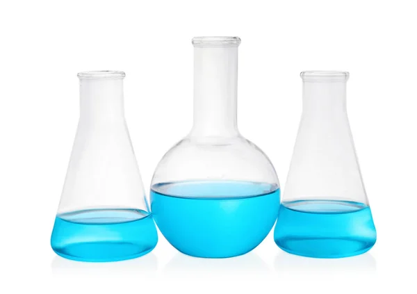 Different Laboratory Glassware Light Blue Liquid White Background — Stock Photo, Image