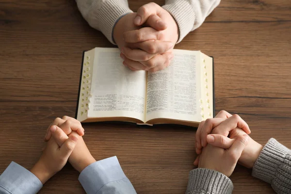 Boy His Godparents Praying Together Wooden Table Closeup — 스톡 사진
