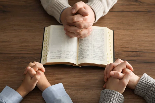 Boy His Godparents Praying Together Wooden Table Closeup — Fotografia de Stock