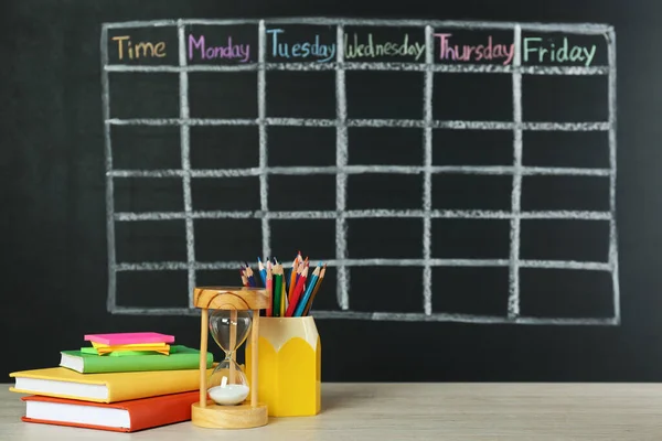 Hourglass Stationery White Wooden Table Blackboard Drawn School Timetable — Stock Fotó