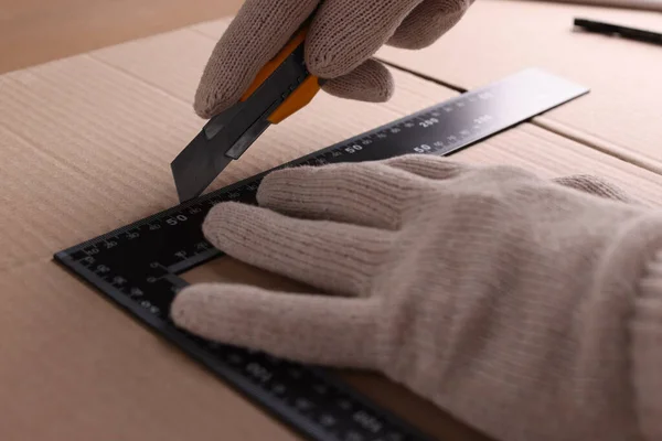 Worker Cutting Cardboard Utility Knife Ruler Closeup — Stock Photo, Image