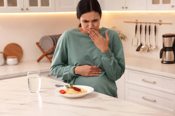 Young Woman Feeling Nausea While Seeing Food Table Kitchen Toxicosis — стоковое фото