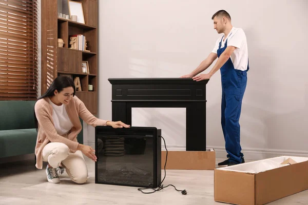 Young Woman Professional Technician Electric Fireplace Room Installing Heater — Foto de Stock