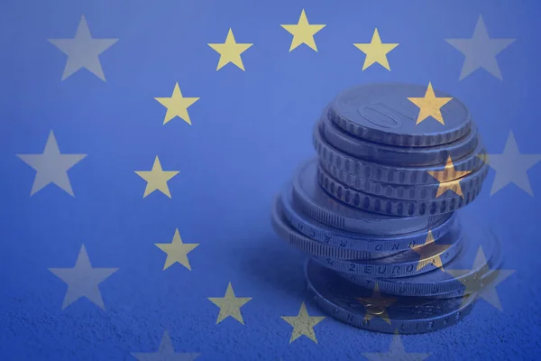 Double Exposure European Union Flag Coins Table Closeup View — Stockfoto