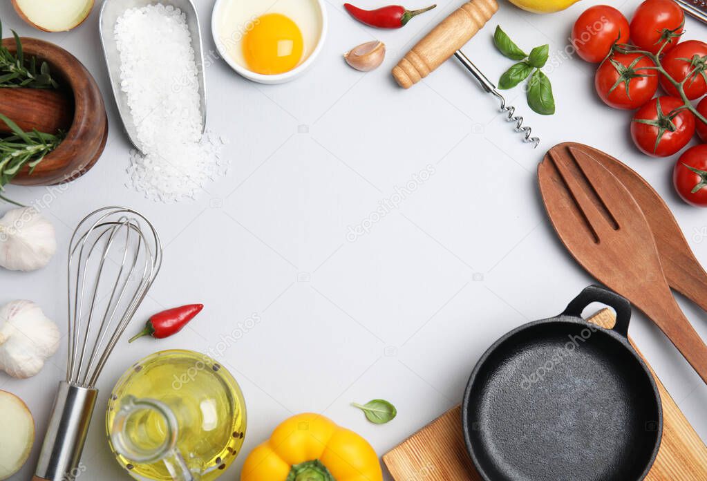 Frame made of cooking utensils and fresh ingredients on white background, top view. Space for text