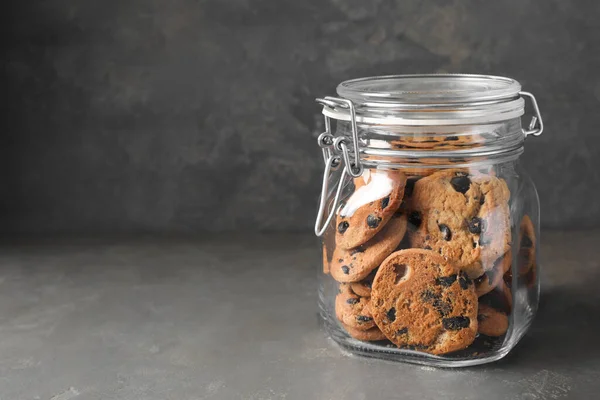 Delicious Chocolate Chip Cookies Glass Jar Grey Table Space Text — Foto de Stock