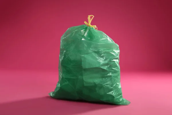 Trash Bag Full Garbage Pink Background — стоковое фото