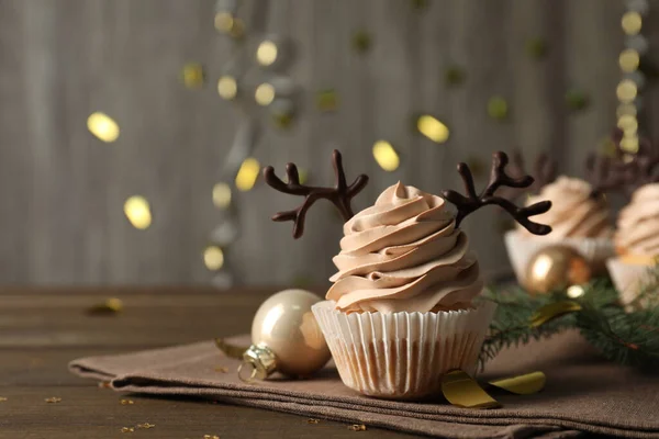Tasty Christmas Cupcake Chocolate Reindeer Antlers Wooden Table Space Text — Foto de Stock