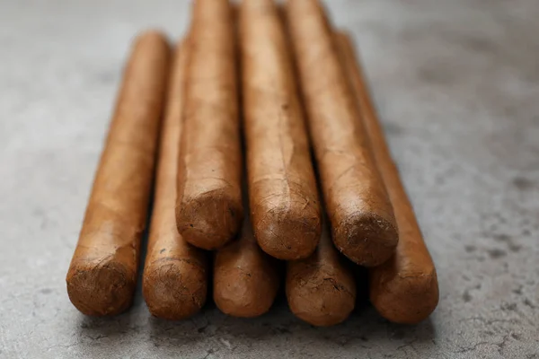 Many Expensive Cigars Grey Table Closeup — Stock Photo, Image