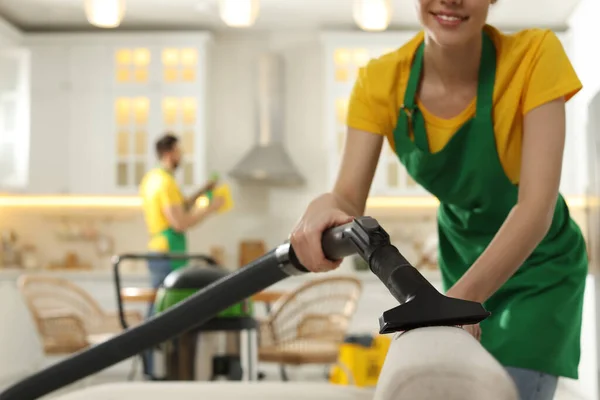 Professional Janitor Uniform Vacuuming Sofa Indoors Closeup Space Text — 스톡 사진