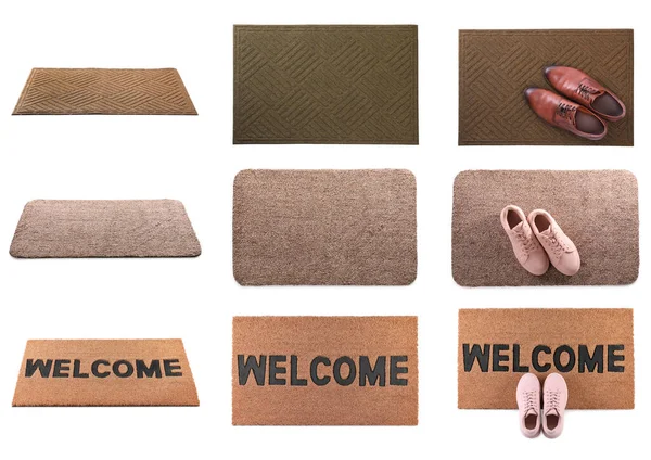 Set with different door mats and shoes on white background