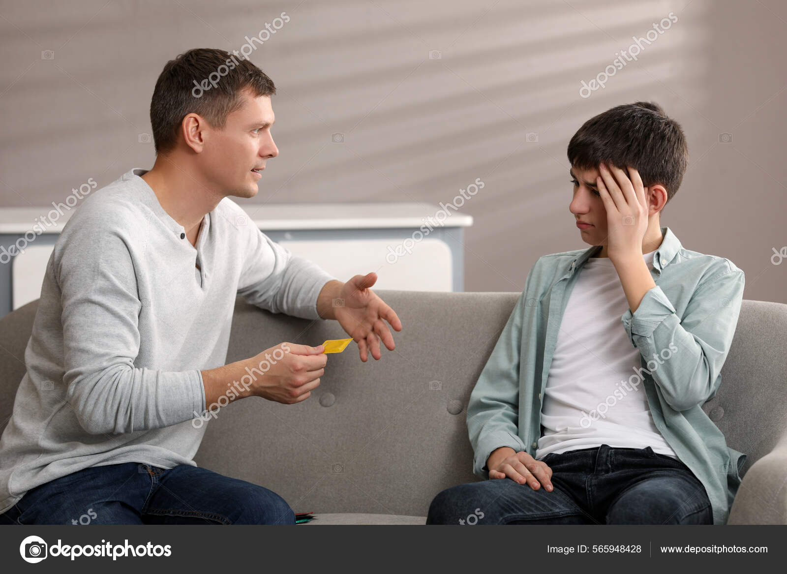 Father Talking His Teenage Son Contraception Home Sex Education Concept Stock Photo by ©NewAfrica 565948428