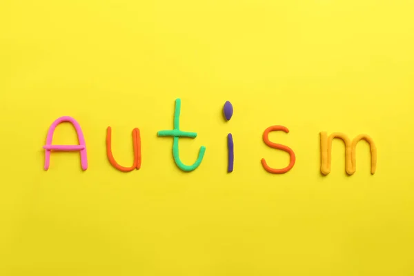 Word Autism Made Colorful Plasticine Yellow Background Flat Lay — Stock Photo, Image