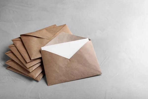 Many Brown Paper Envelopes Light Grey Table Space Text — Fotografia de Stock