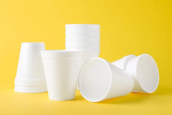 Many White Styrofoam Cups Yellow Background — Foto de Stock