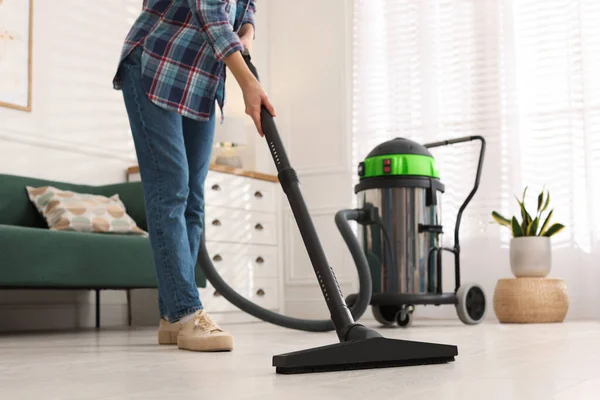 Woman Vacuuming Floor Living Room Closeup — стоковое фото