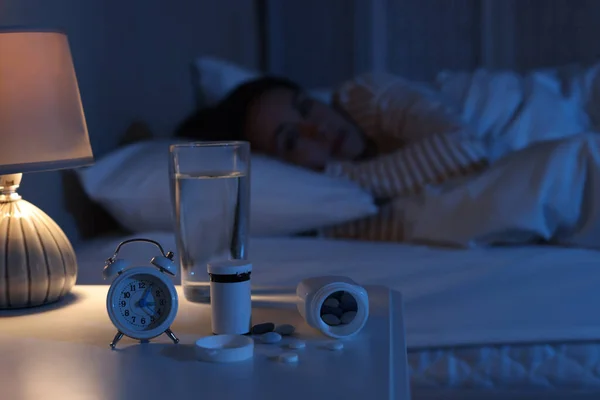 Woman Suffering Insomnia Bed Night Focus Nightstand Pills Alarm Clock — Foto Stock