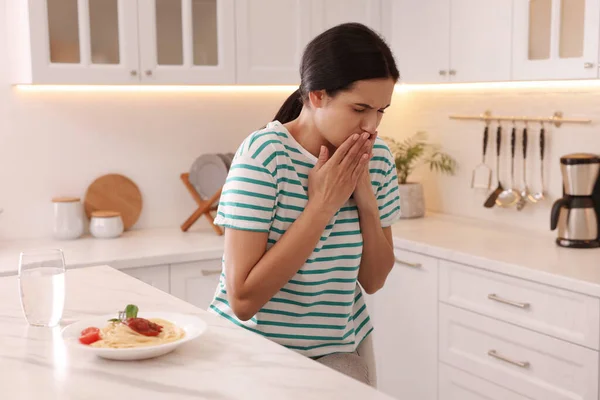 Young Woman Feeling Nausea While Seeing Food Table Kitchen — Stockfoto