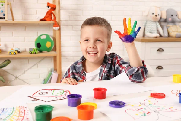 Happy Little Boy Showing Painted Palm White Table Room — Stock Photo, Image