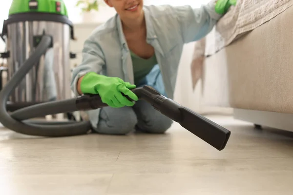 Young Woman Vacuuming Floor Bedroom Closeup — стоковое фото