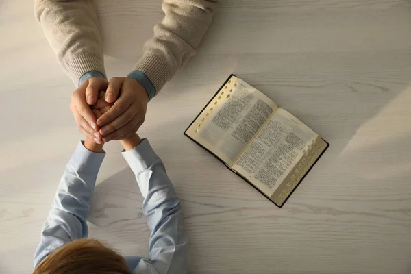 Boy His Godparent Praying Together White Wooden Table Closeup — Fotografia de Stock