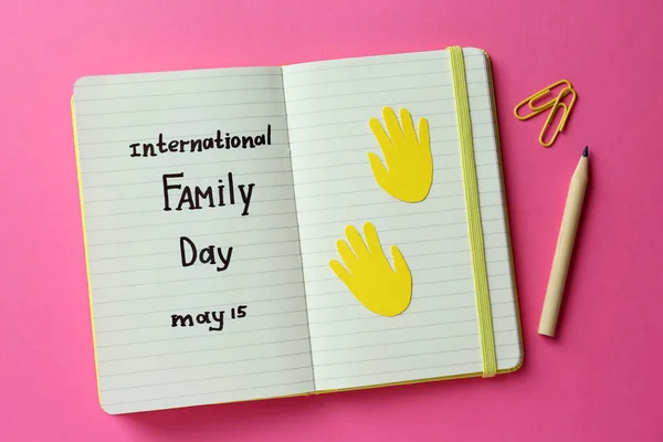 Notebook Text International Family Day May Pencil Paper Clips Pink — Fotografia de Stock