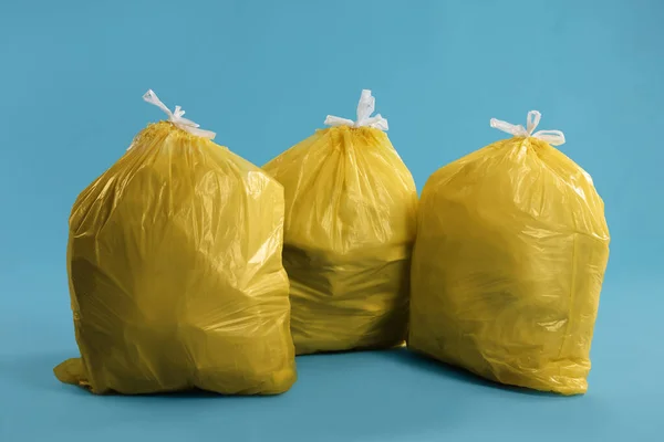 Trash Bags Full Garbage Light Blue Background — Stock fotografie