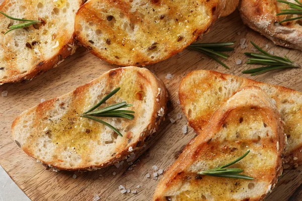 Tasty Bruschettas Oil Rosemary Wooden Board Top View — Fotografia de Stock