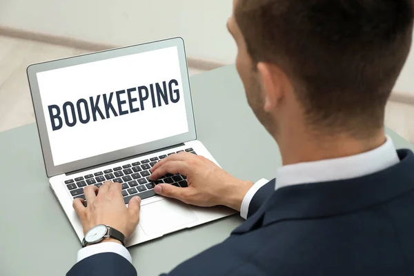 Bookkeeping Concept Man Working Laptop Grey Table Closeup — Stockfoto