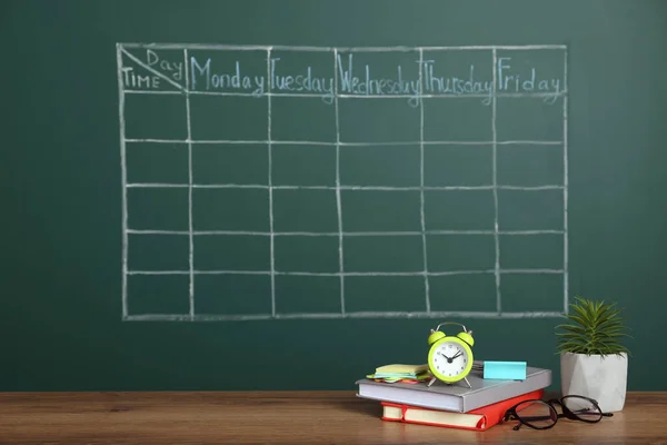 Alarm Clock Stationery Plant Wooden Table Green Chalkboard Drawn School — Stockfoto