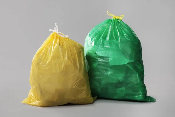 Trash Bags Full Garbage Grey Background — стоковое фото