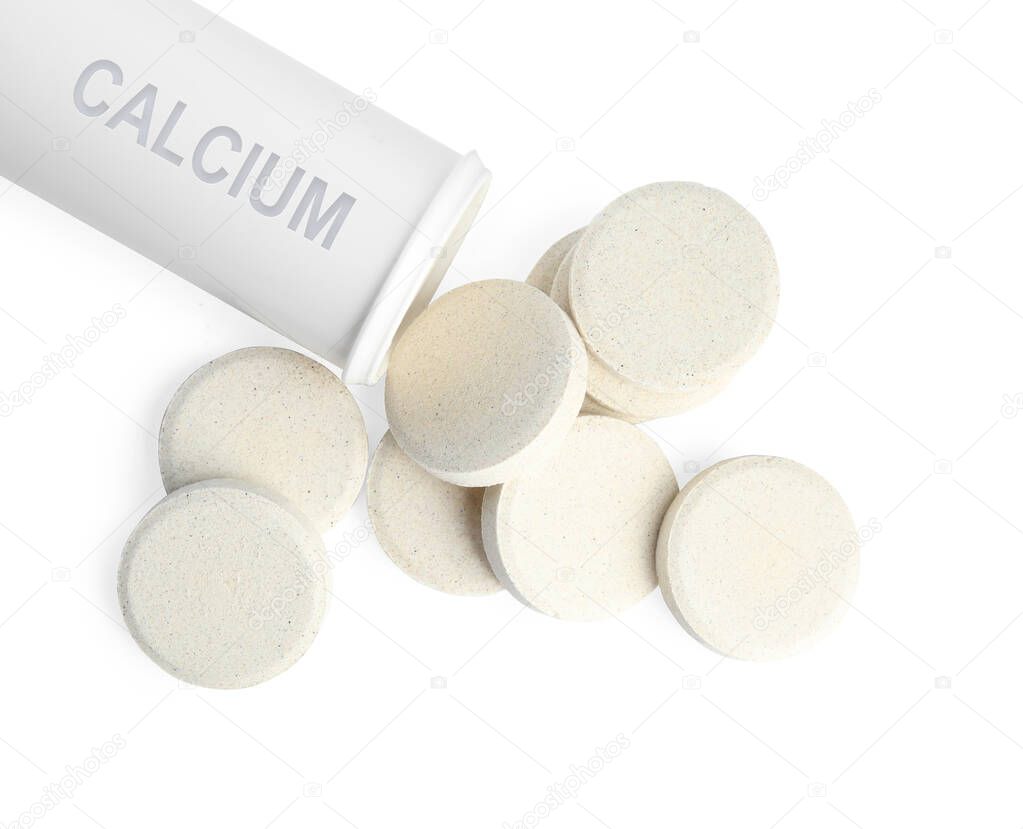Calcium supplement. Bottle and tablets on white background, top view