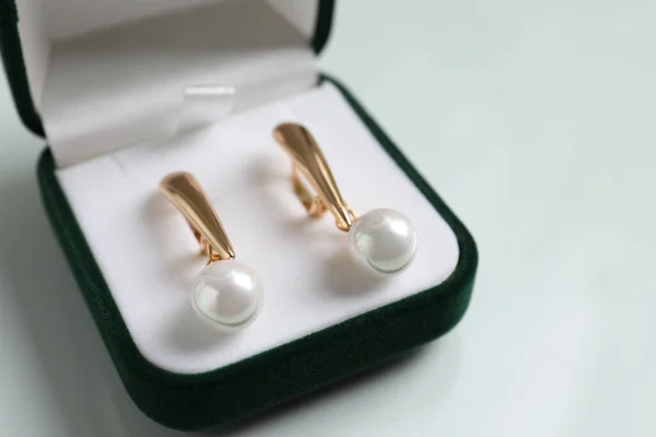 Elegant Golden Earrings Box White Table Closeup — Stok fotoğraf