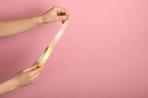 Woman Holding Beige Adhesive Tape Pink Background Closeup Space Text — Fotografia de Stock