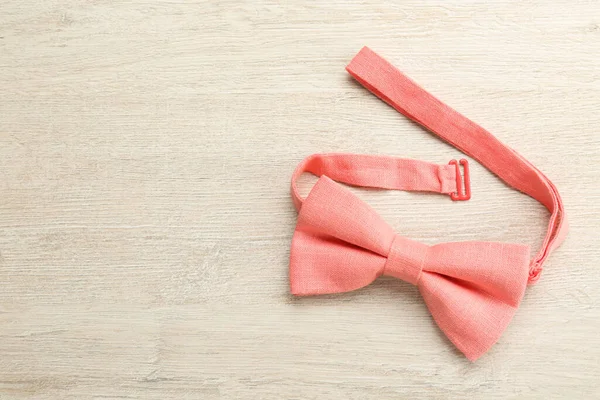Stylish Pink Bow Tie Wooden Background Top View Space Text — Zdjęcie stockowe