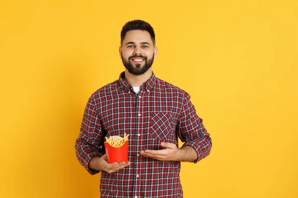 Young Man French Fries Orange Background — Stock Photo, Image