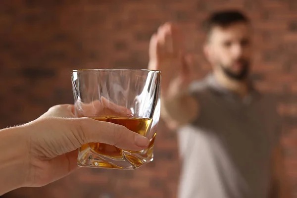 Man Refusing Drink Whiskey Red Brick Wall Closeup Alcohol Addiction — 스톡 사진